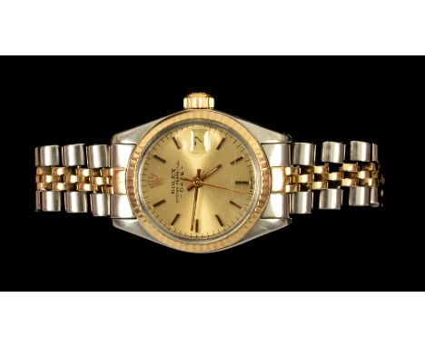A ladys Rolex Oyster Perpetual Date Wristwatch, the champagne dial with hourly baton markers, sweep seconds hand and date ape