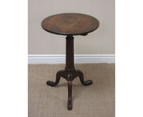 A George III oak Pillar Table, the circular top above a gun barrel turned column raised on tripod supports, 1ft 5in W
