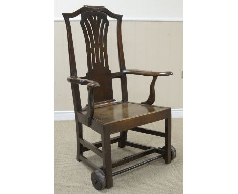 An 18th Century Country Chippendale oak Invalid Armchair with pierced splat, shaped arms, solid seat on chamfered square fron