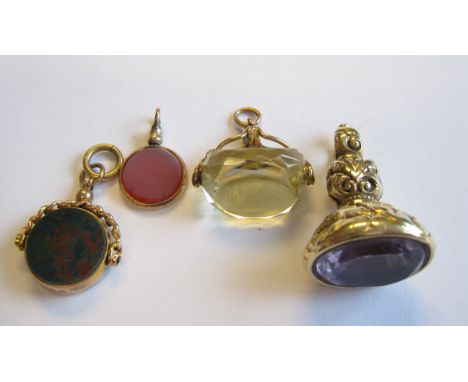 A 9ct gold Swivel Fob set carnelian and bloodstone, a small Fob set carnelian, a Citrine Swivel Fob in 9ct gold mount and a F