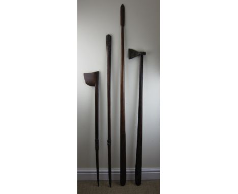 Four Maori Weapons, New Zealand, comprising an axe, 47in. L, tewhatewha, 41in. L, another tewatewha shaft, 52in. L, and an un