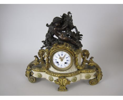 A 19th Century French Mantel Clock, dial inscribed F.L. Hausburg a Paris, with goat and cherub surmount, white enamel dial wi