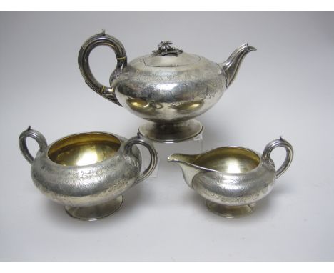 A Victorian silver three piece Tea Service, floral and scroll engraved, London 1843, maker: W.C