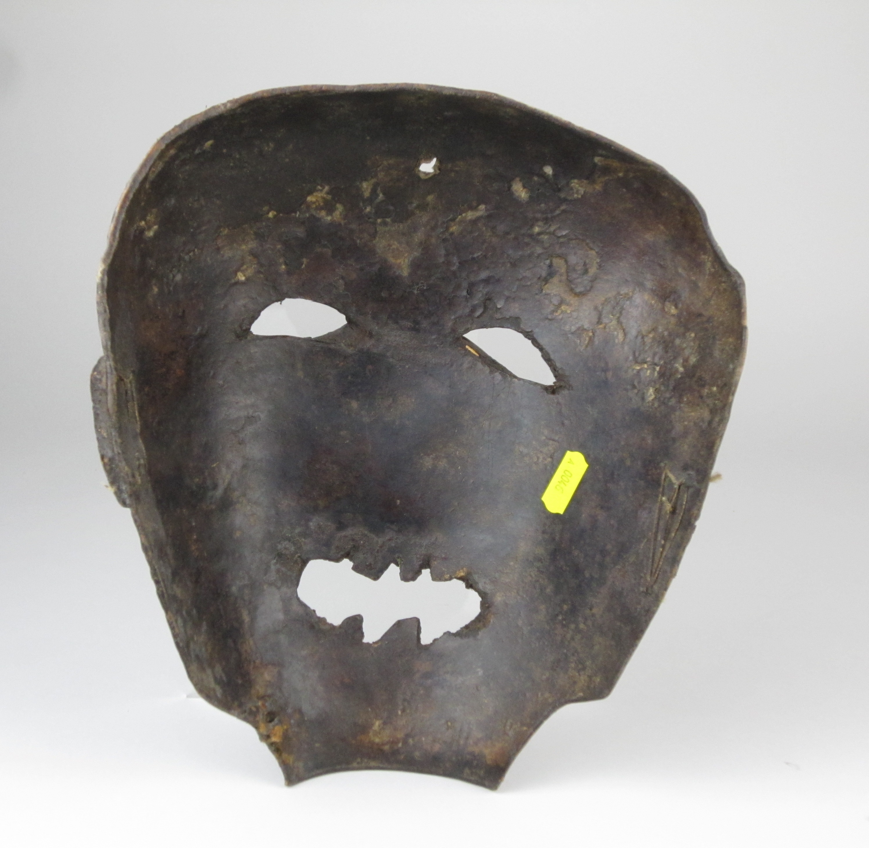 Two Tanzanian Masks, comprising a striking Haya mask, the leather face ...