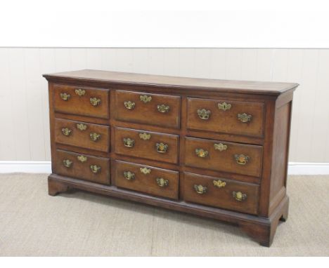 An 18th Century oak Lancashire Chest fitted nine drawers with mahogany cross-banding on bracket feet, 5fft 4in