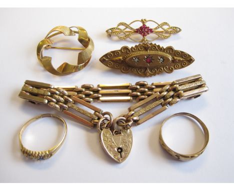 An engraved gatelink Bracelet with padlock fastener, Ruby Brooch, a Ruby and Diamond Brooch and a circular Brooch all marked 