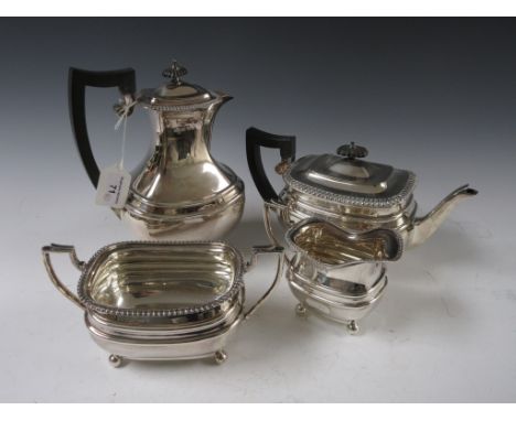 A George V silver four-piece Tea Service of boat shape with gadrooned border, raised on ball feet, Birmingham 1918, maker: Da