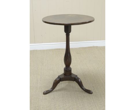 An 18th Century oak Pillar Table with circular one piece top on baluster column and tripod base, 19in
