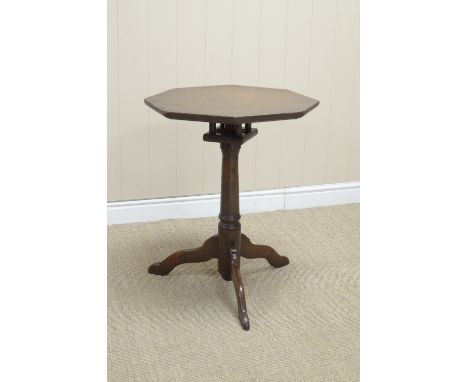 An 18th Century oak Pillar Table with octagonal top on bird cage support, turned column and tripod base, 19 1/2in