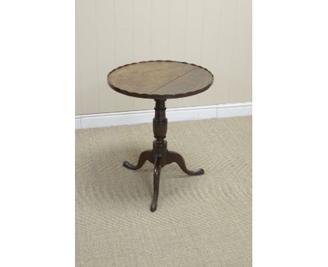 An 18th Century oak Pillar Table with circular top having shaped rim on vase turned column and tripod base, 20 1/2in