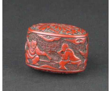 A rare Japanese red lacquer Netsuke, Edo Period,In the form of an oval single case inro or kogo, carved with figures playing 