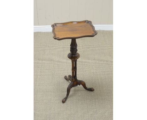 A 19th Century rosewood Pillar Table with dished shaped rectangular top on turned, carved and fluted triple column, leafage c