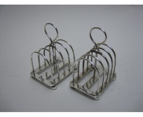 A pair of Victorian silver five bar Toastracks on bun feet, Sheffield 1899, maker: Mappin & Webb