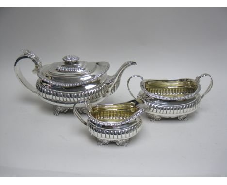 A George III silver three piece Tea Service of boat shape with anthemion and paw feet, London 1817, maker: Joseph Angell