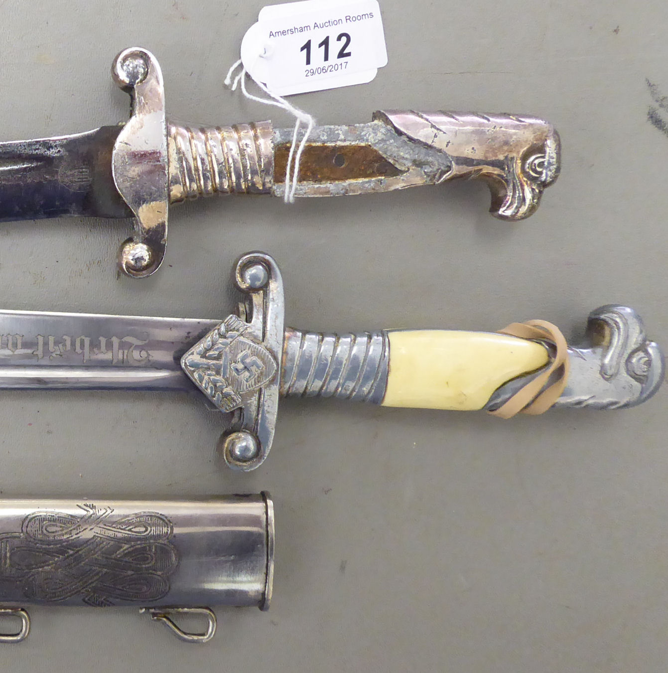 Two Reproduction World War II German Daggers, Viz. An RAD Dagger And ...