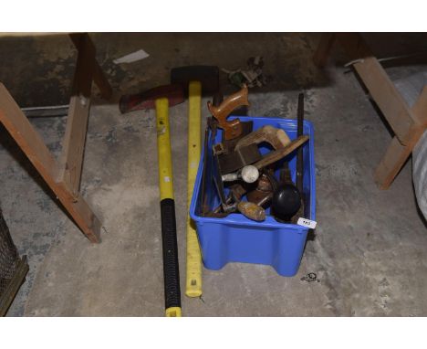 A collection of assorted tools to include a sledge hammer, axe, oil cans, hacksaw etc. 