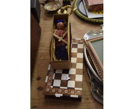 A boxed Pelham Puppet Together with a wooden inlaid chess board. Condition report:Head and hands good, clothes good, nocharac