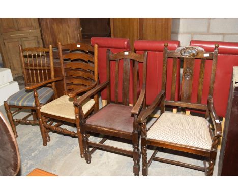 Four assorted Oak chairs, to include an oak ladder back elbow chair. 1920's Oak lath back elbow chair. Second similar chair a