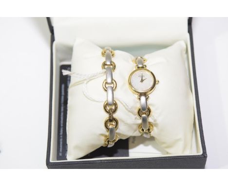 A Rotary wristwatchThe circular mother of pearl dial to the stainless steel and pold plated bracelet, together with accompany