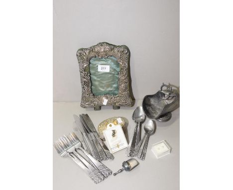 A collection of white metal item Including photograph frame, lidded pots, cutlery, etc. (qty) 