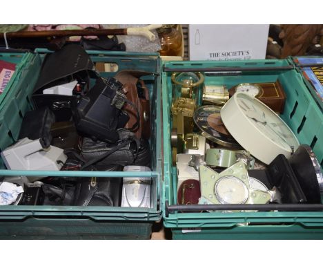 A large collection of various cameras Including Polaroid, Cannon, etc, together with a quantity of clocks, some wooden cased 