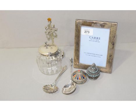 A mixed group of silver and white metal items Including a silver topped jar, silver spoon, together with bead and enamel deco