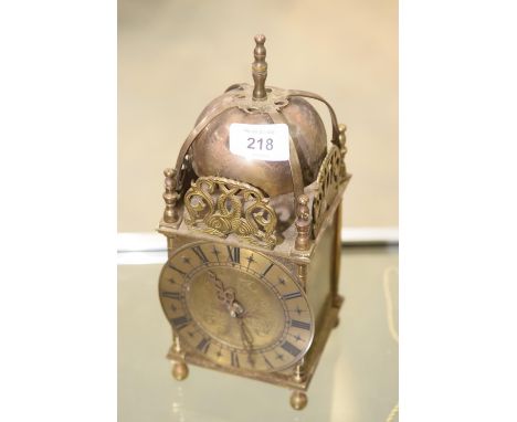 A reproduction brass cased lantern clock by Smiths. 