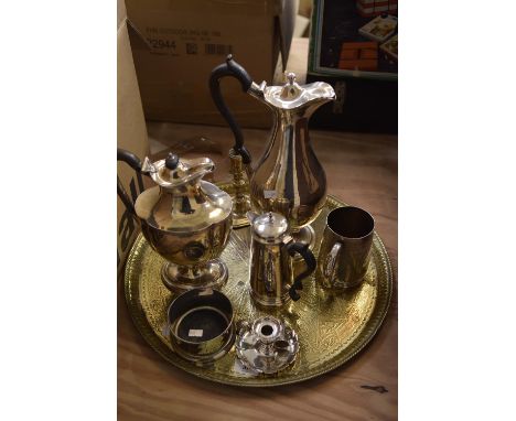 A mixed group of metal items Including plated hot water jugs, tankard, candle holder, brass candle stick, brass ectched charg