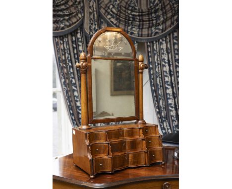 A GEORGE IV ROSEWOOD VENEER CRUTCH MIRROR OF LARGE PROPORTIONS,the compartmented domed glass plate above a three tier graduat