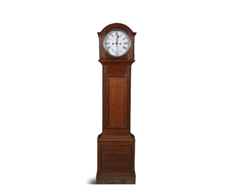 AN OAK LONGCASE CLOCKwith arched hood and circular glazed doors enclosing a white painted dial with Roman numerals, twin wind