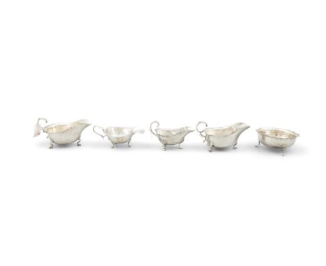 A PAIR OF SILVER HELMET SHAPED SAUCE BOATSSheffield c.1912, makers mark rubbed, wavy rims, c-scroll handles, pad feet, 15cm w