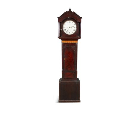 AN IRISH 19TH CENTURY LONGCASE CLOCKthe arched hood enclosing a white enamel dial inked with Roman numerals and signed indist