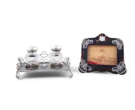 AN EDWARDIAN TORTOISE SHELL AND SILVER MOUNTED STANDISH,London 1906, with raised wirework borders, fitted with silver capped 