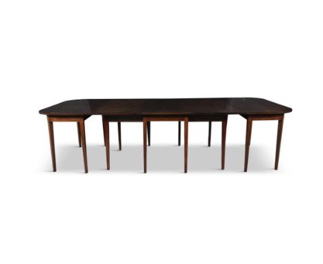 A MAHOGANY EXTENDING DINING TABLE 19TH CENTURY,of rectangular form, with rounded corners with gate-leg centre section and two