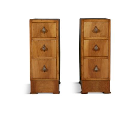A PAIR OF COMPACT ART DECO WALNUT BEDSIDE CHESTS,each of upright rectangular shape, fitted with a row of three drawers, with 