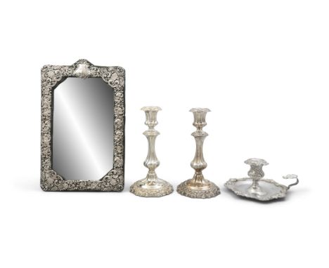 A SILVER MOUNTED CUSHION MIRROR,Birmingham c.1902, mark of Henry Matthews, the bevelled rectangular plate enclosed within a h