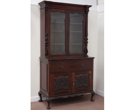 Early 19th century mahogany secretaire bookcase, two shaped bevelled edged glass doors enclosing three shelves, above drawer 