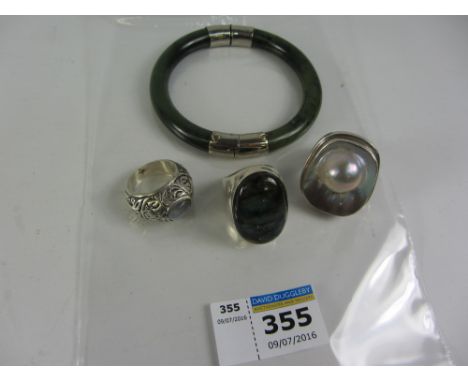 Jade hinged bangle,  two rings stamped 925 and a moonstone ring Condition Report Click here for further images, condition, au