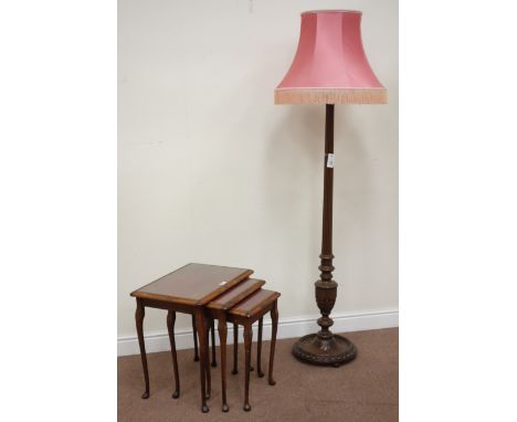 Early 20th century walnut standard lamp, turned and fluted with carved decoration and a nest of three tables Condition Report
