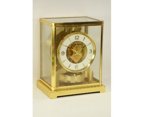 Jaeger-LeCoultre Atmos clock gilt and burnished case, white round dial with Roman numerals, W18cm, H22cm  CLOCKS & BAROMETERS