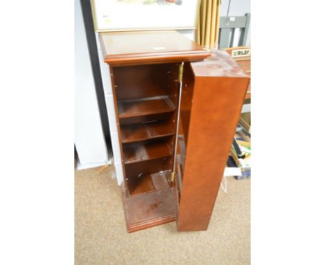 A modern hinging CD cupboard with adjustable shelving, 97cms high.