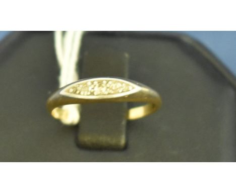 Diamond ring, the five graduated stones in a marquise shaped mount, on yellow metal shank.