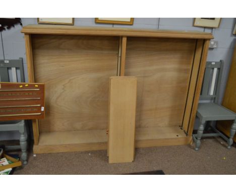 A modern light oak open bookcase with adjustable shelving, 182cms wide.