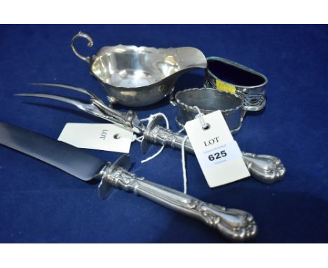 Silver items, including: sauce boat; table sale with blue glass liner; napkin ring; and a carver and fork with white metal ha