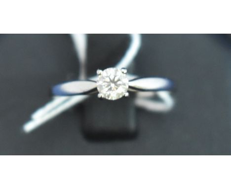 Diamond ring, the brilliant cut diamond by Rox, on white metal shank stamped 'Pw 18K'.