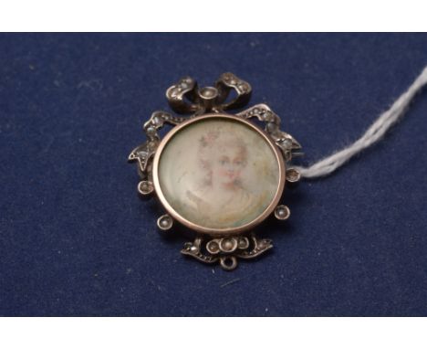 A miniature portrait brooch, the female bust within seed pearl set ribbon mount.