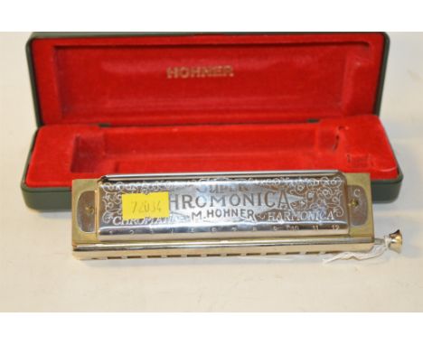 A Hohner 270 harmonica in fitted case.