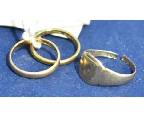 Two gold wedding bands, one 22ct, one 18ct; and a 9ct gold signet ring (cut).