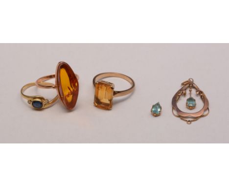 A citrine ring, the shank stamped '9ct'; an amber ring, on 14ct gold shank; a sapphire and diamond ring, on 18ct gold shank; 