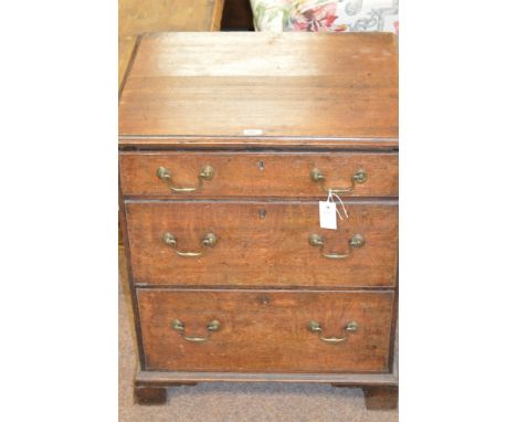 A small Georgian chest of three drawers, raised on bracket feet, 78cms high.